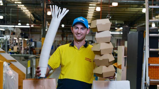 Detmold machine operator Toby Burt with the products the company normally manufactures. Picture: Brenton Edwards