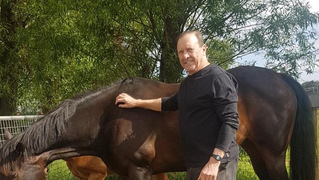 Cr Ablett with a horse he co-owns with property developer John Woodman.