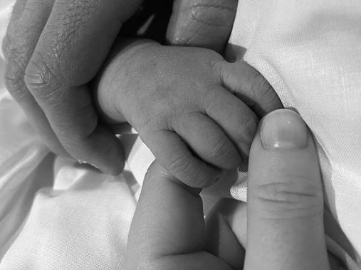 Princess Eugenie posted a photo of her and husband Jack Brooksbank holding their new baby's hand. Picture: Instagram