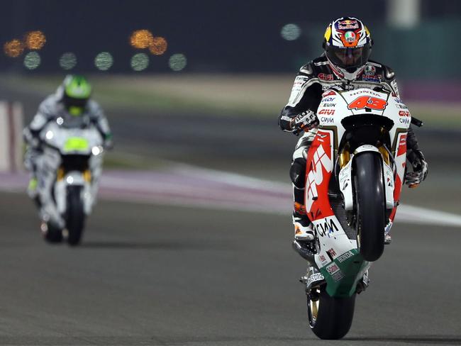 Miller and teammate Cal Crutchlow head out of the pits.