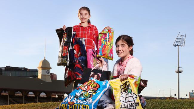 Gladstone Regional Council have nominated a show holiday which aligns with Brisbane’s Ekka holiday. Picture: Esther McKeering, 8, Ascot, and Ruby Gibson, 11, Alderley, with EKKA showbags, Bowen Hills. Picture: Liam Kidston