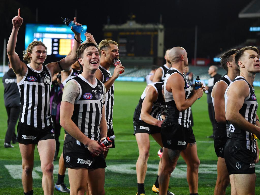 Port Adelaide players celebrating their victory over the Adelaide Crows in last year’s Showdown.