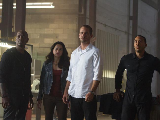 Hits movie screens on April 2 ... (From left) Tyrese Gibson as Roman, Michelle Rodriguez as Letty, Paul Walker as Brian, and Chris "Ludacris" Bridges as Tej, are back for Furious 7. Picture: AP / Universal Pictures, Scott Garfield