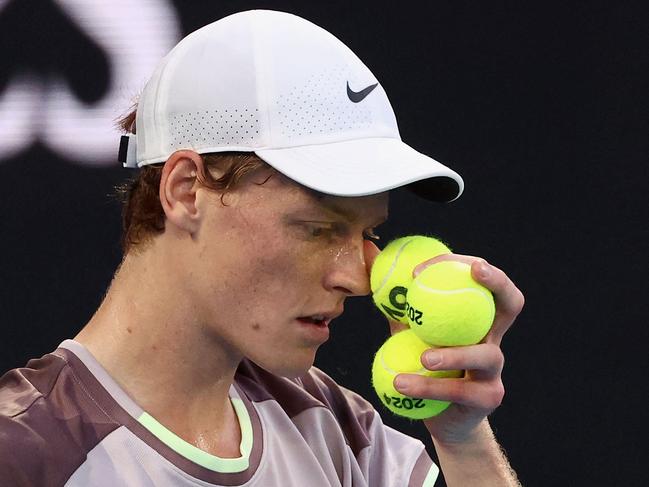 Italy's Jannik Sinner prepares to serve against Russia's Daniil Medvedev during their men's singles final match on day 15 of the Australian Open tennis tournament in Melbourne on January 28, 2024. (Photo by David GRAY / AFP) / -- IMAGE RESTRICTED TO EDITORIAL USE - STRICTLY NO COMMERCIAL USE --