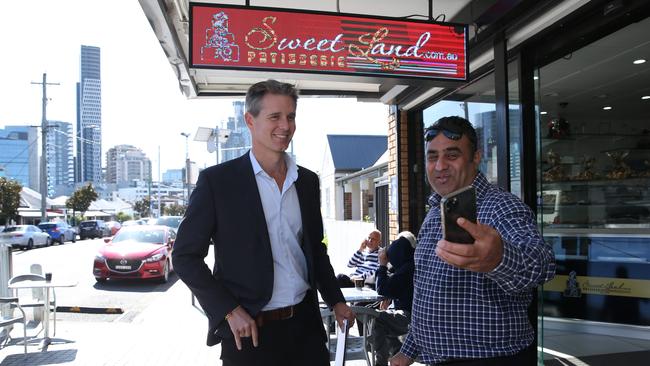 Labor candidate for Parramatta Andrew Charlton poses for a fan photo at the Sweet Land patisserie in Harris Park in Sydney’s west. Picture: Britta Campion