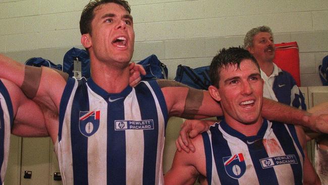 1998 Qualifying final. North Melbourne (Kangaroos) v Essendon. MCG. Jubilant Roos Mick Martyn, Wayne Carey and Anthony Stevens celebrate.