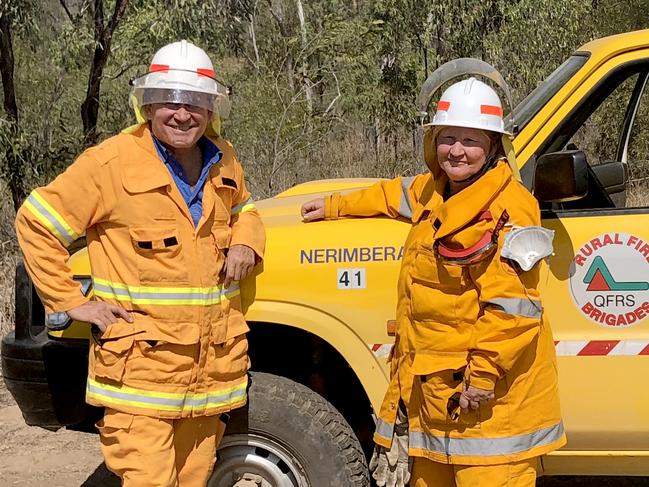 Ian McDonald and Kathleen Ellrott of the Nerimbera Rural Fire Service keep an eye out on the blazes above North Rockhampton