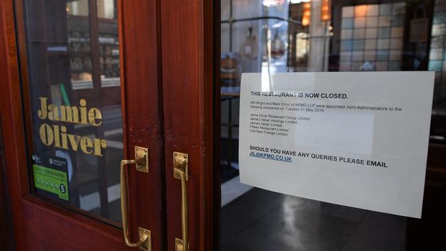 A sign in the door of a closed-down Jamie's Italian restaurant in Manchester, northern England on May 21, 2019, notifies people the KMPG have been appointed as administrators to the Jamie Oliver Restaurant Group. Picture: Paul Ellis/AFP