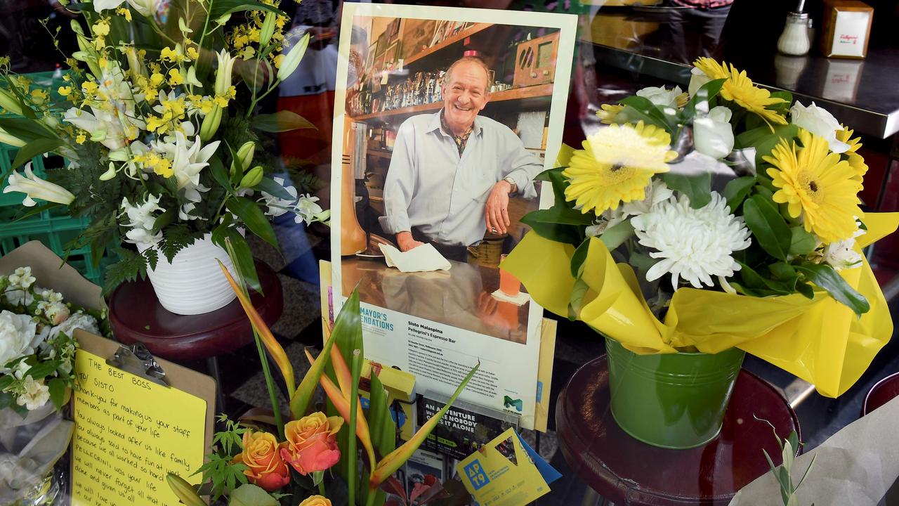 Floral tributes for Sisto Malaspina in the restaurant window. Picture: William West/AFP