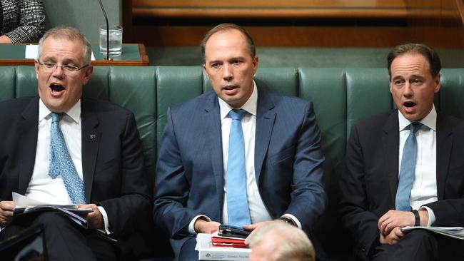 Treasurer Scott Morrison, Immigration Minister Peter Dutton and Environment Minister Greg Hunt during Question Time. Picture: AAP/Mick Tsikas