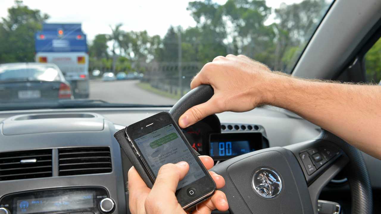 Texting while driving. Photo: Warren Lynam / Sunshine Coast Daily. Picture: Warren Lynam