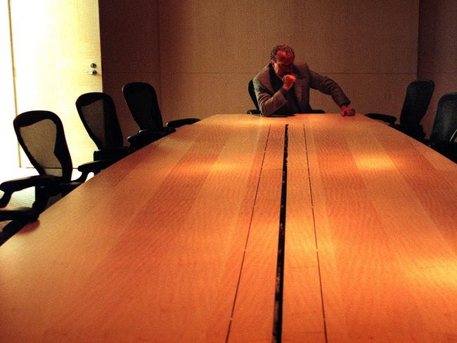 Generic image of company boardroom table with chairman or chief executive at head of the table 05 Apr 2000. business businessman board room desk