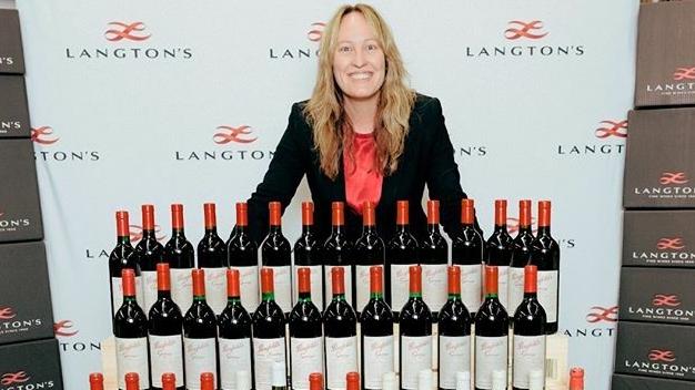 Langton's general manager Tamara Grischy with the 65 years of Penfolds Grange sold at an auction.