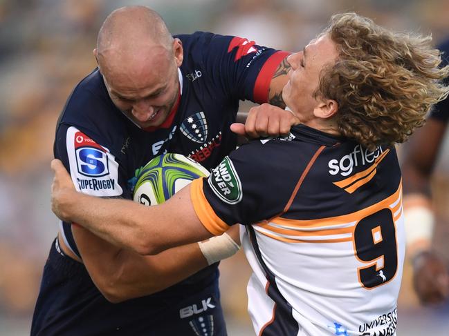 Billy Meakes of the Rebels (left) is tackled by Joe Powell of the Brumbies during the Round 2 Super Rugby match between the ACT Brumbies and the Melbourne Rebels at GIO Stadium in Canberra, Friday, February 7, 2020. (AAP Image/Lukas Coch) NO ARCHIVING, EDITORIAL USE ONLY