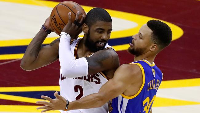 Kyrie Irving handles the ball against Stephen Curry in the 2017 NBA Finals.