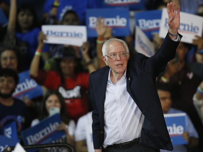 Democratic presidential candidate Sen. Bernie Sanders waves to the crowd from the stage at a campaign rally in Phoenix. Picture: AP