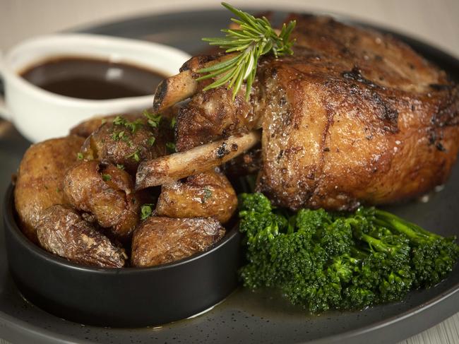 Doctor Syntax’s 18-hour apple and fennel braised pork loin is a generous serving which features two loin chops on the bone with garlic slicked baby spuds, broccolini and a jug of jus and poached pear. Picture: Chris Kidd