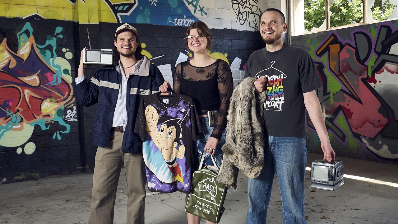 Owners Isaac Troup, Esther Troup and Benjamin Troup showing off a collection of vintage clothes at the carpark on Ranelagh St where My Dead Grandpa will begin operating from in February 2025. Picture: Matt Loxton