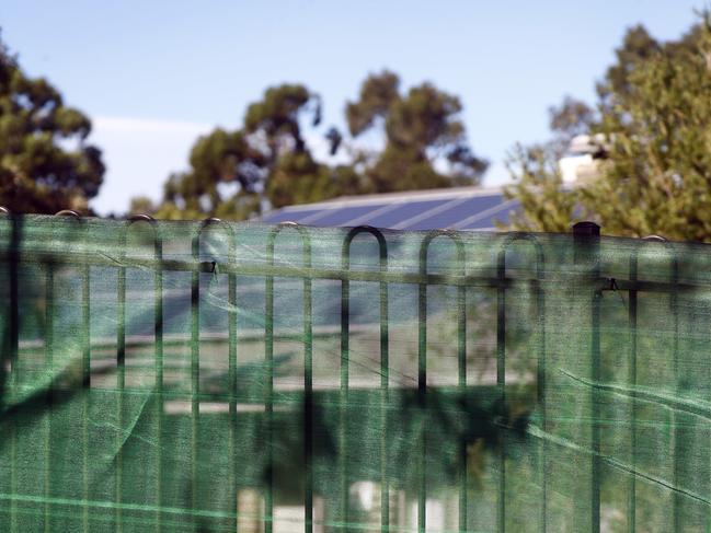 Cloth barriers put up along the fence at Newmarch House to prevent people looking inside. Picture: Sam Ruttyn