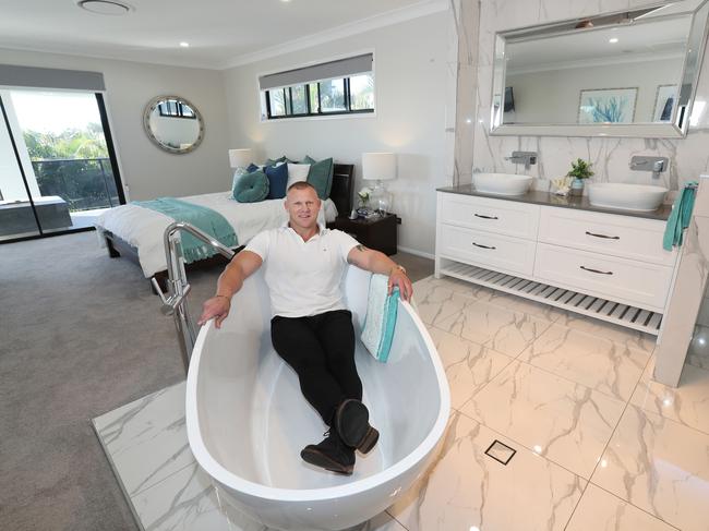 Troy Williamson is very pleased with his open plan ensuite renovation. Picture: Annette Dew