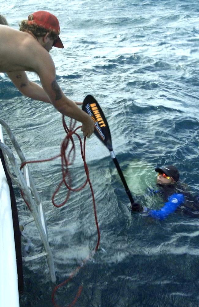 Help at hand … an exhausted Bonnie is pulled out of the water on one of many upsets during the voyage. Pic: Blake Bradford