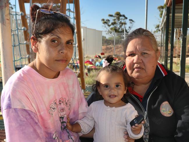 Lavene Ngatokorua, (black jacket), acting CEO of the Davenport Community Council in Port Augusta with councillor Charelle Dingaman and her 1 year old daughter,, Chereena Price, at the run-down Tji Tji Wiru recreation centre in the Davenport community. There has been a spike in youth crime in Port Augusta, with young kids apparently roaming the streets, sometimes until the early hours of the morning. 1 March 2023. Picture Dean Martin