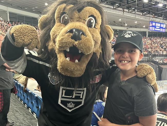 Tommy, 12, at an ice hockey game.