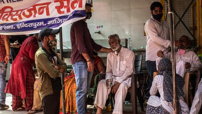 COVID-19 sufferers are treated with free oxygen at a makeshift clinic in Indirapuram, Uttar Pradesh, India. Picture: Getty Images