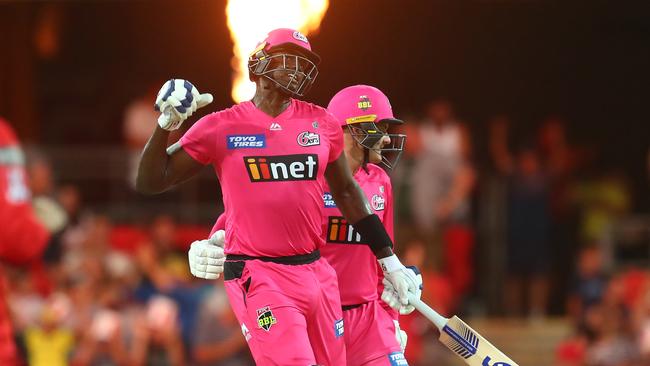 Holder celebrates his clutch batting performance with teammate Ben Manenti. Picture: Getty Images