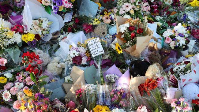 Thousands of flowers and messages have been left for the Clarke family Picture: Liam Kidston