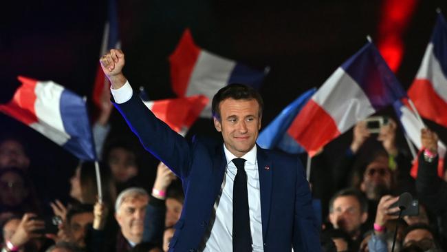 Emmanuel Macron addresses supporters in front of the Eiffel Tower after beating his far-right rival Marine Le Pen for a second five-year term as president. Picture: Getty Images.