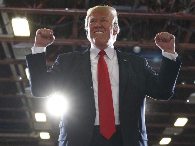 President Donald Trump reacts to the cheering crowd as he leaves a rally at the Four Seasons Arena at Montana ExpoPark, Thursday, July 5, 2018, in Great Falls, Mont., in support of Rep. Greg Gianforte, R-Mont., and GOP Senate candidate Matt Rosendale. (AP Photo/Carolyn Kaster)