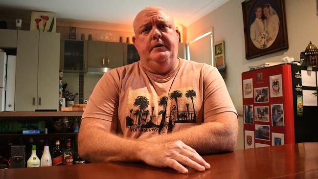 John “Benny” Benstead, an Australian Army veteran, struggles to breathe after an alleged industrial accident driving a loader for Holcim in Bohle, Townsville in early 2023. “As soon as I start breathing heavily, coughing starts, excruciating pain, I can’t breathe, light-headed and you can’t do a thing,” he said at the Kirwan home he shares with wife Racheal. “This is just asphyxiating, painful death sentence, I wouldn’t wish it on my worst enemy.” Picture: Cameron Bates