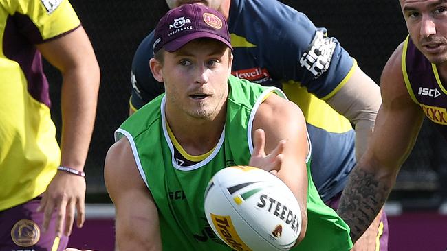 Todd Murphy passes the ball during a Brisbane Broncos training session at Red Hill. Picture: AAP Image/Dave Hunt