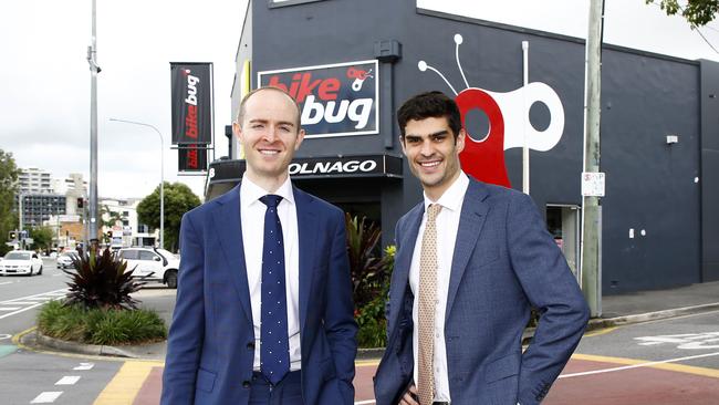 Michael Feltoe and Lachlan O'Keefe at the Gabba property they sold. Picture: Tertius Pickard