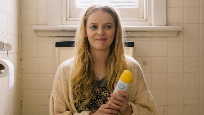 Alice Foulcher as Polly, pretending to accept an Oscar while on the toilet. As you do.