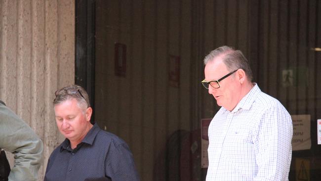 Public servants Stuart Munnich and George Timson leave Alice Springs Local Court. Picture: Gera Kazakov