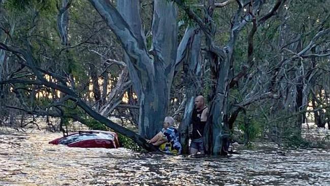 A woman is rescued in flood waters in Elmore last night. Picture: Victoria Police