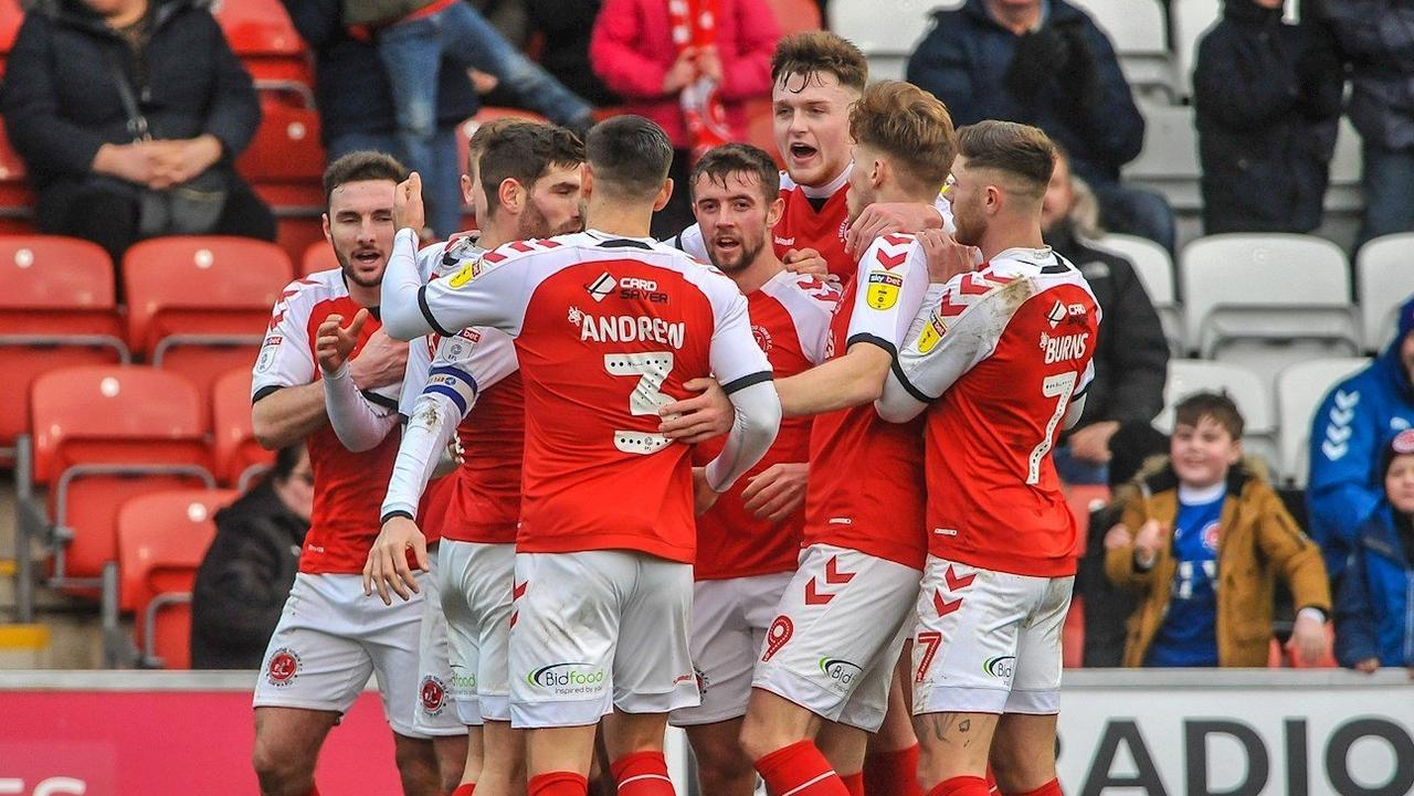 Harry Souttar (3R) celebrates with his Fleetwood Town teammates. Credit: Fleetwood Town FC.