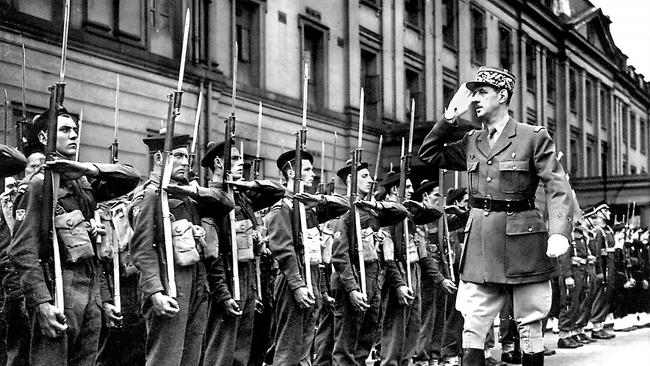 General Charles de Gaulle reviews commandos in London on Bastille Day 1942.