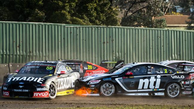 Jake Kostecki in his Tradie Racing Ford Mustang and Nick Percat in Mobil1 NTI Racing Holden Commodore ZB collide on the opening lap of race 3. Picture: Daniel Kalisz/Getty Images