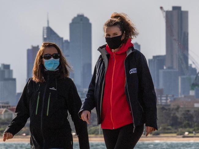 Scenes around melbourne with people out and about in masks exercising, walking dogs riding bikes around southeast melbourne. Picture: Jason Edwards