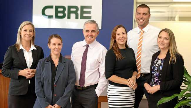 WINNING WAYS: Kate Pascoe, left, and CBRE team members Rachael Mokoroa (assistant property manager), Rem Rafter (managing director), Tori Dodd (property manager), Ryan Parry (manager) and Eboney Shedden (property manager).