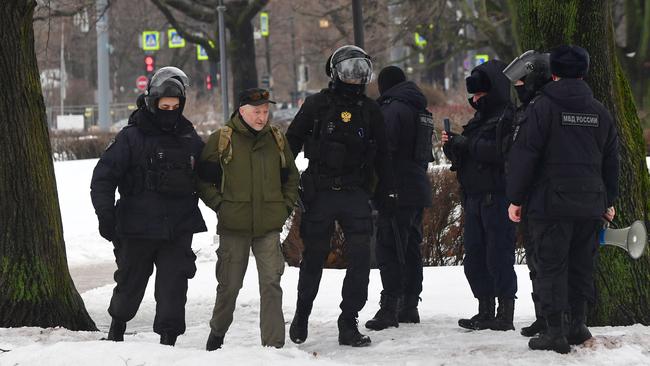 Police detain a man in Moscow near the monument to the victims of political repression. Picture: AFP