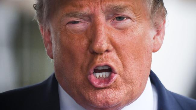 (FILES) In this file photo US President Donald Trump speaks to the press before departing the White House  on June 20, 2020 in Washington, DC, for a campaign rally in Tulsa, Oklahoma. - One of Donald Trump's brothers requested a restraining order to block publication of a potentially explosive book written by the US president's niece, The New York Times reported June 23, 2020. Mary Trump will release her no-holds-barred memoir "Too Much and Never Enough: How My Family Created the World's Most Dangerous Man," on July 28, according to publishing house Simon & Schuster. (Photo by Eric BARADAT / AFP)