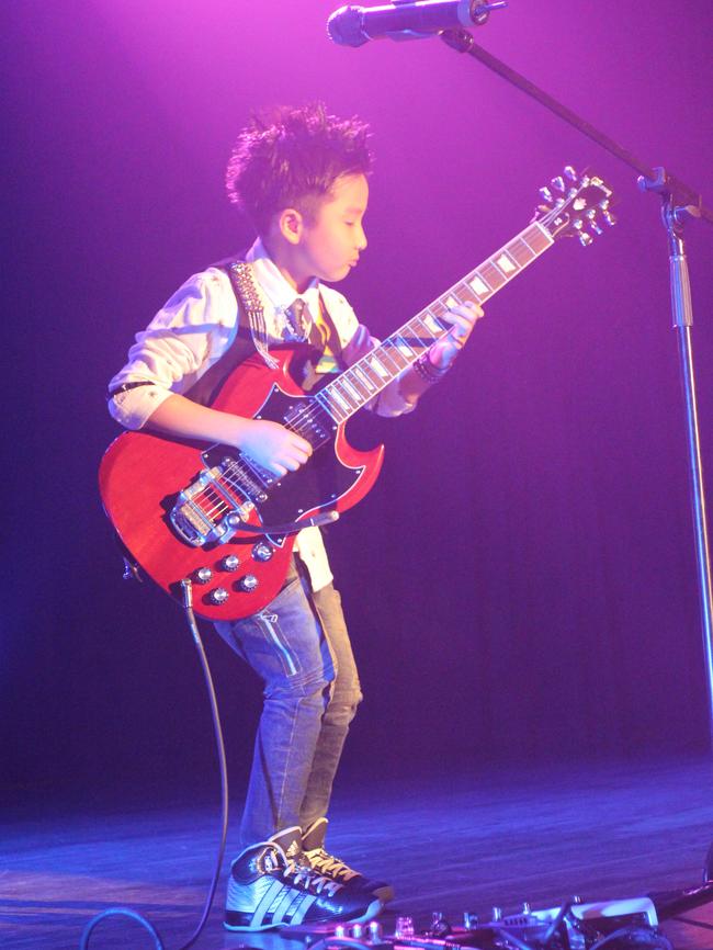 Jeremy Yong shows off his musical talents.