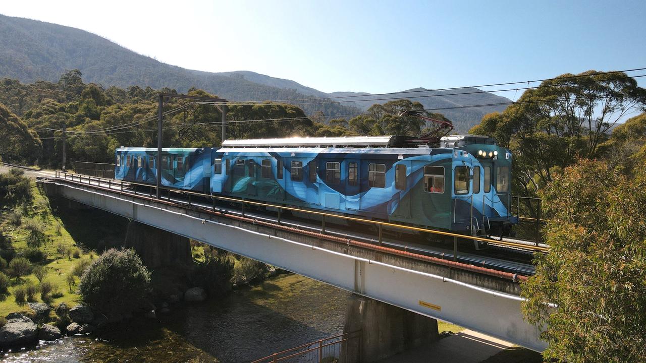 The Skitube looks different this year after a mural was painted on it inspired by the views that can be seen from the train. Picture: Perisher