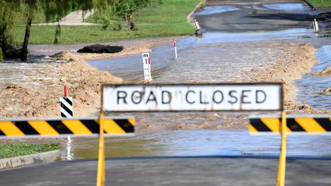 Flood water inundate a road in Dalby, Queensland, Monday, February 10, 2020. Flood water have started to recede after Myall Creek which runs through the town broke its banks yesterday. (AAP Image/Dan Peled)