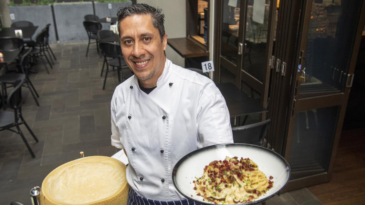 Piccolo Papa head chef Jose Chong with cheese wheel pasta. Picture: Nev Madsen.