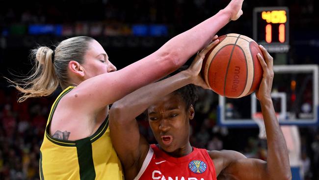 Australia's Lauren Jackson (L) blocks Canada's Kayla Alexander (R).